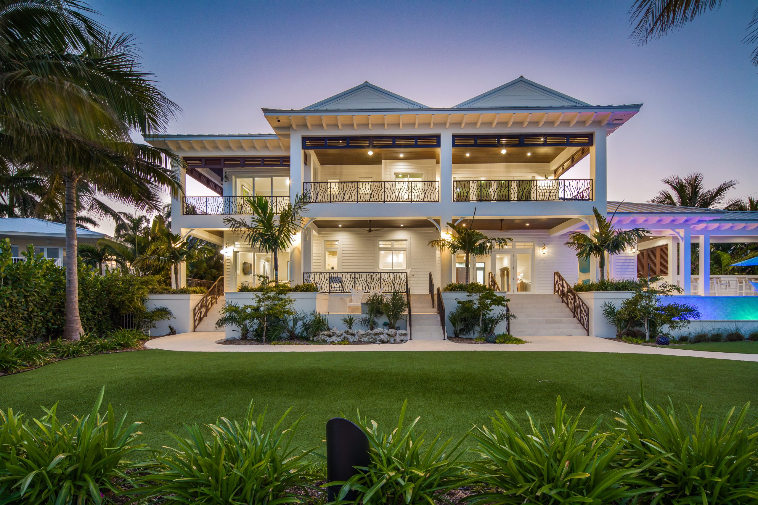 Coastal Source installed over 200 lights in this sprawling luxury property, resulting in a stunning display of landscape lighting design. [Photo credit | Coastal Source]